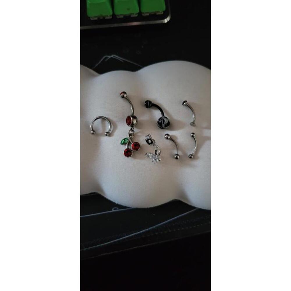 Bodyartforms Navel belly piercings and one septum